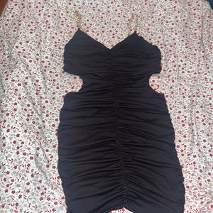 Black dress size M , stretchy and very comfortable , open sides
